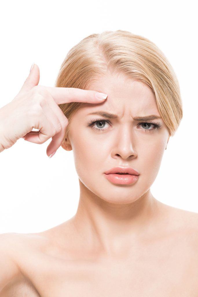 By inhibiting muscle contractions, Botox minimizes dynamic wrinkles from facial expressions like frowning, squinting, or smiling.